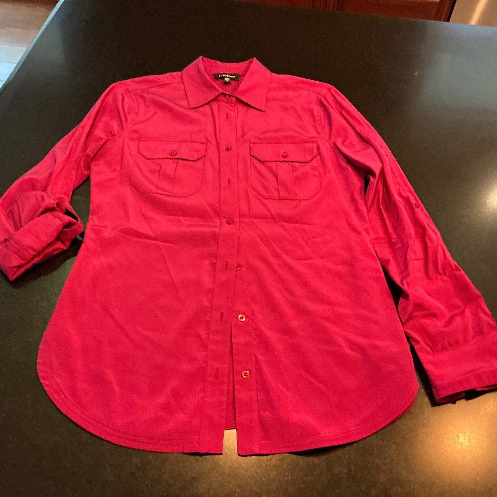 Bright pink blouse made by Bebe, size medium. Long sleeve.
